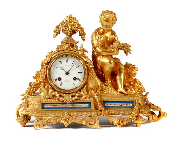 Appraisal: A Louis XV style gilt bronze and porcelain mounted figural