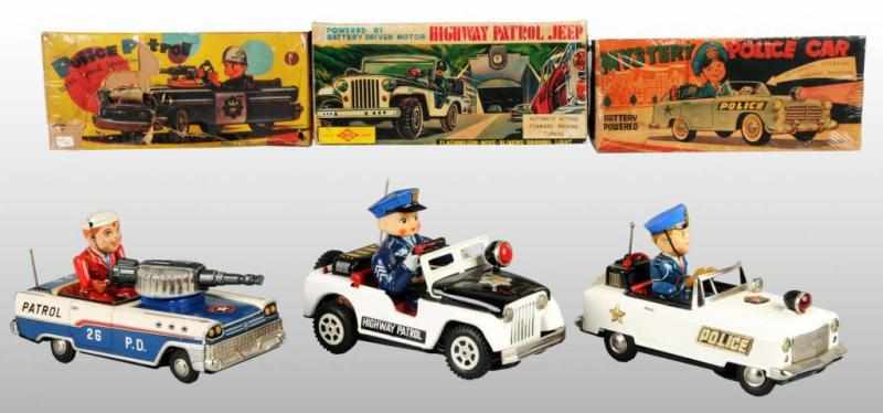 Appraisal: Lot of Tin Police Dept Car Battery-Op Toys Description Japanese