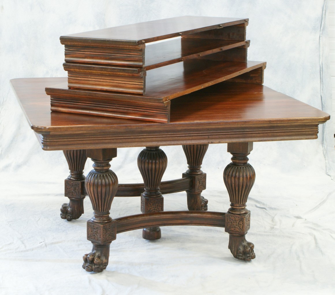 Appraisal: Mahogany Victorian square dining table with three leaves carved paw