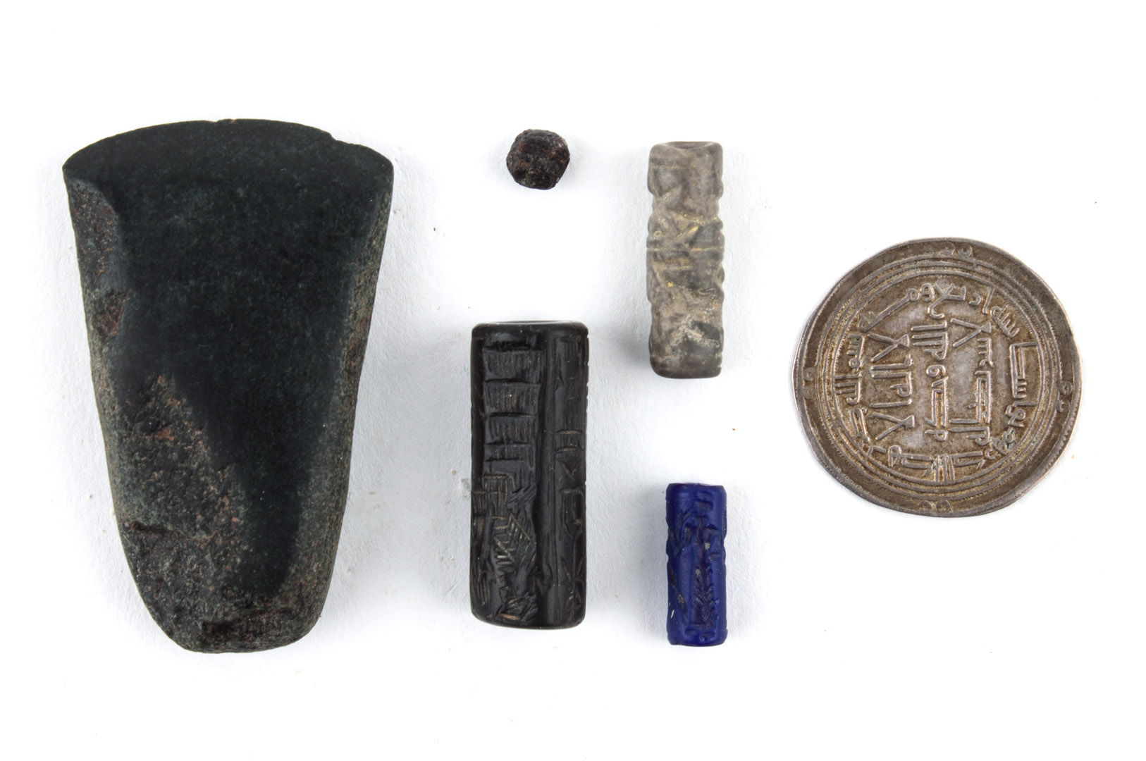 Appraisal: Three Mesopotamian cylinder seals and other items comprising black stone