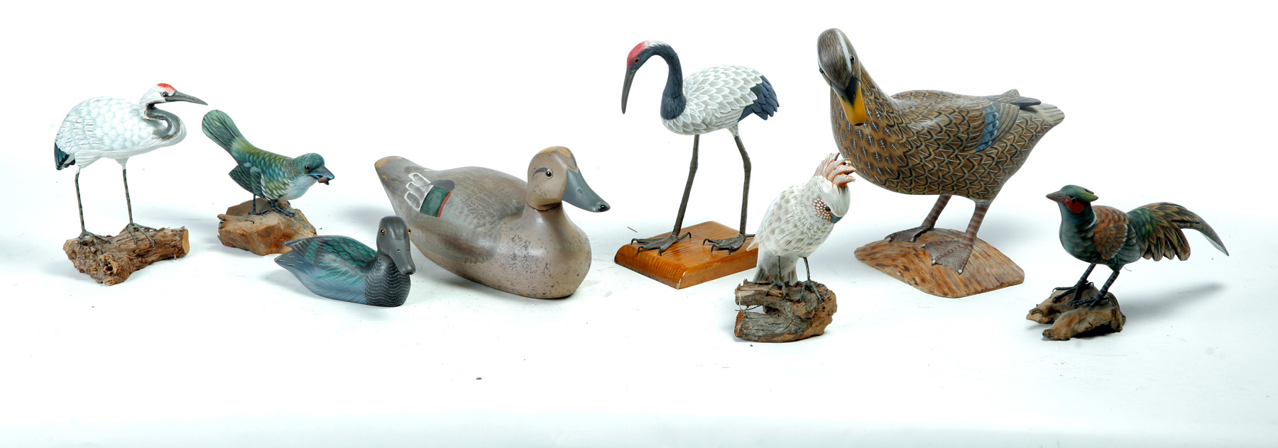 Appraisal: EIGHT AMERICAN BIRD CARVINGS Twentieth century A decoy l two