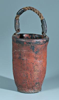 Appraisal: Leather water bucket multiple layers of red and black paint