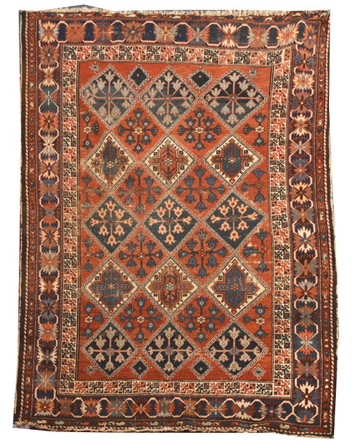 Appraisal: A BAKHTIARI RUST GROUND RUG decorated three rows of five