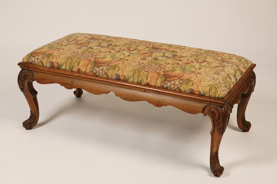 Appraisal: A VICTORIAN WALNUT FRAMED STOOL the rectangular top with an