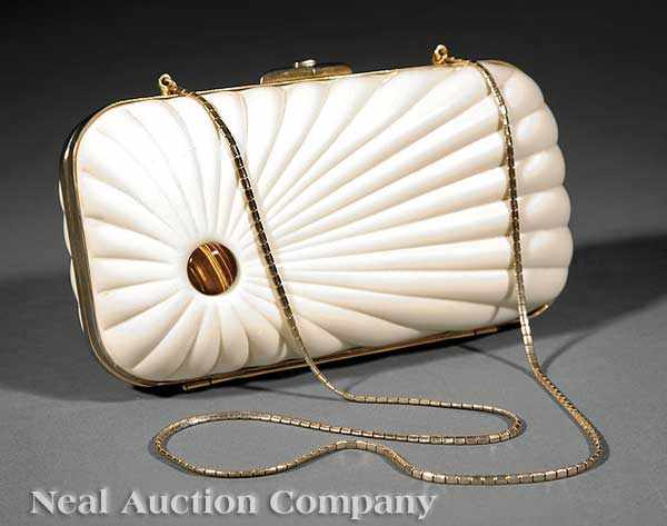 Appraisal: A Judith Leiber Cream Lucite Clutch simulating carved ivory inset