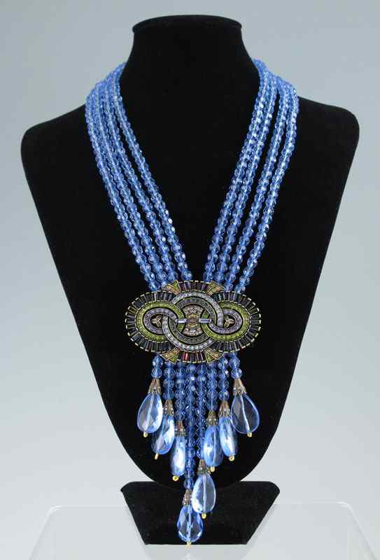 Appraisal: HEIDI DAUS ''BAGUETTE BRILLIANCE'' NECKLACE Crystal accented swirl design geometric