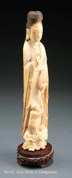 Appraisal: A Chinese Ivory Figure of Guanyin with the Acolyte Sudhana