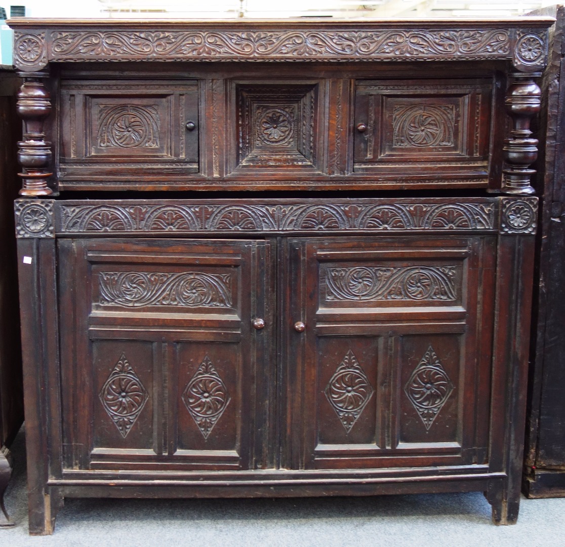 Appraisal: A th century carved oak court cupboard with turned decoration