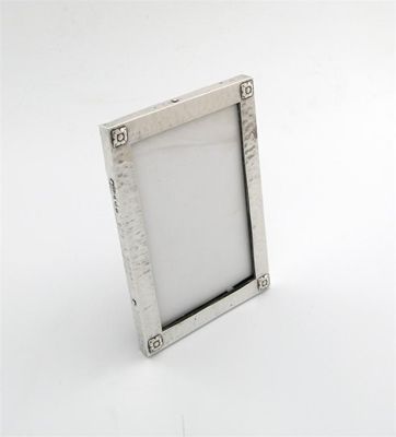 Appraisal: By A E Jones a silver photograph frame Birmingham rectangular