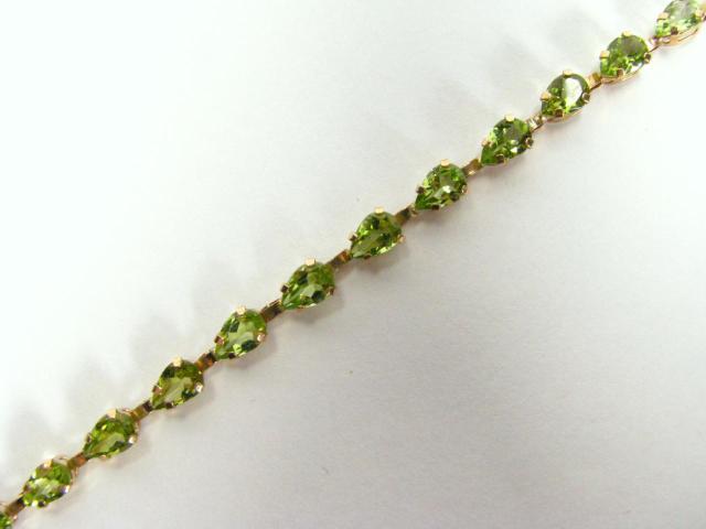 Appraisal: K Yellow gold bracelet with twenty pear shaped green tourmaline