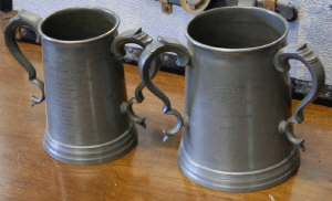 Appraisal: Two Caius College Cambridge pewter rowing tankards