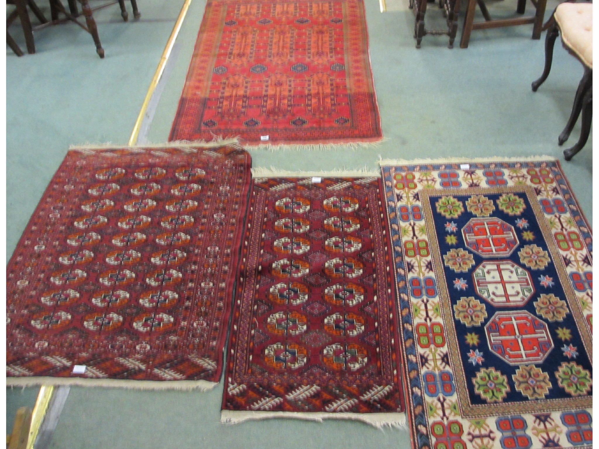 Appraisal: Four various Persian rugs three on red ground