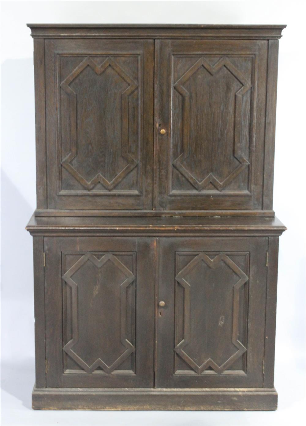 Appraisal: GOTHIC STYLE STAINED OAK CUPBOARD having a straight molded cornice