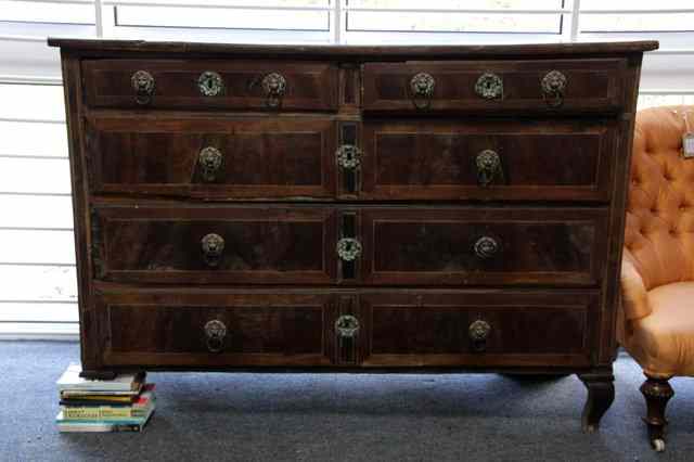 Appraisal: An th Century walnut and parquetry inlaid commode fitted two