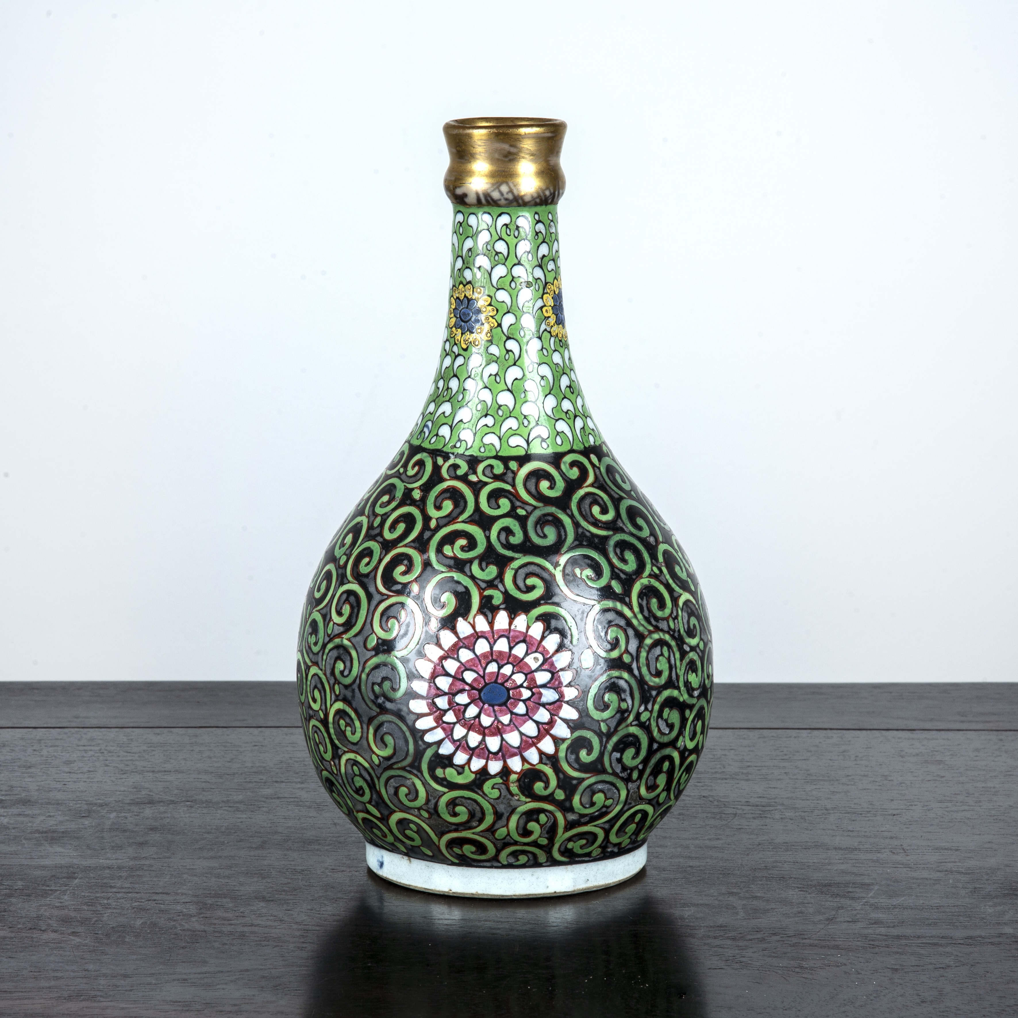 Appraisal: Clobbered bottle vaseChinese th Century with Persian style green trailing