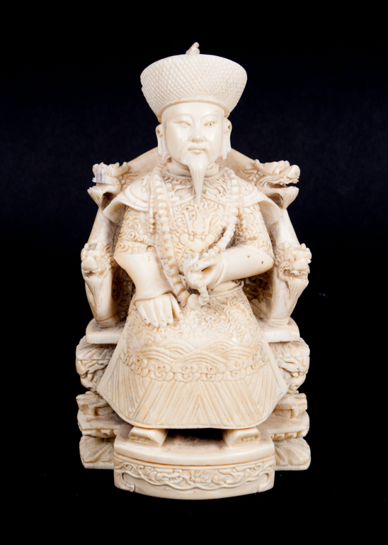 Appraisal: Chinese carved ivory seated mandarin first half- th century modeled