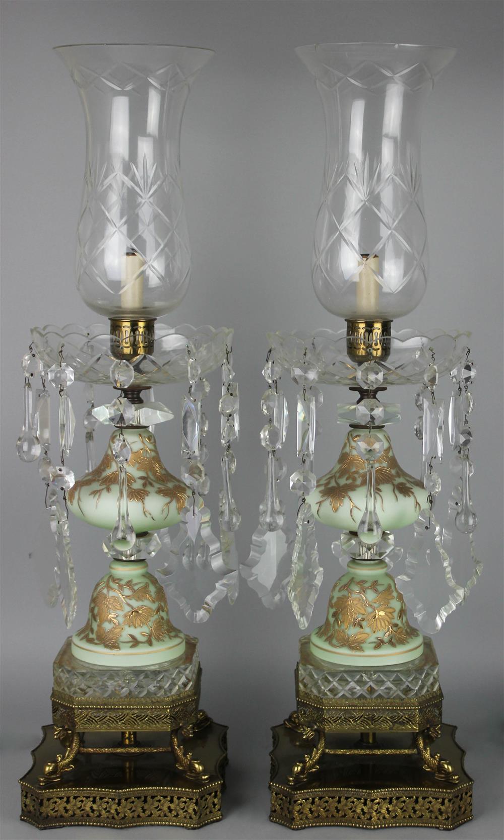 Appraisal: PAIR OF SATIN AND CUT GLASS HURRICANE LAMPS with tulip