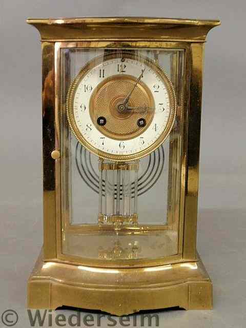 Appraisal: French brass and bow-front beveled glass mantel clock with a