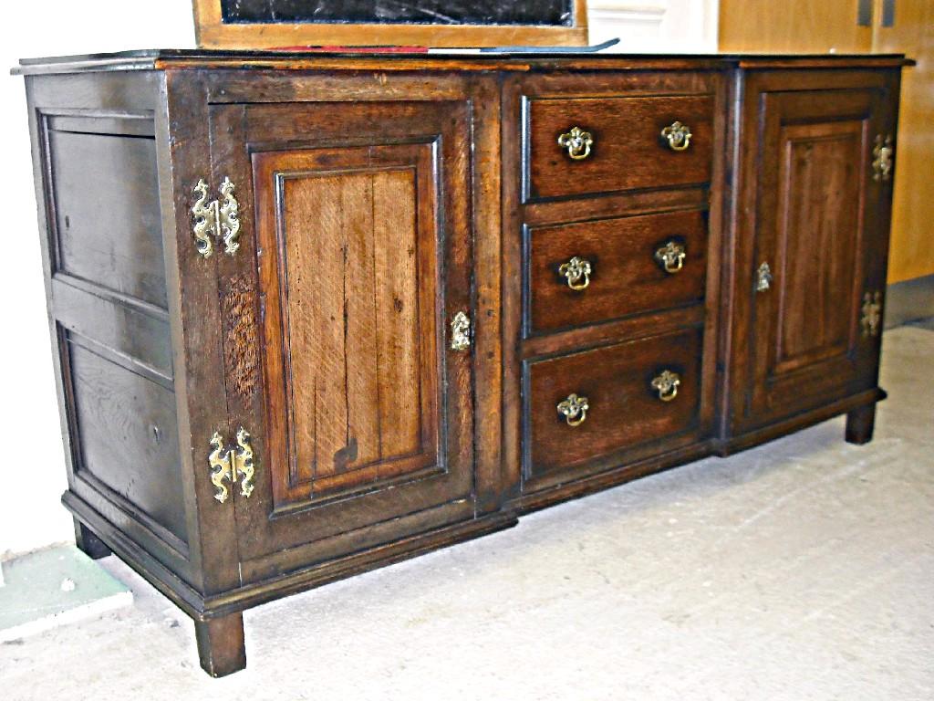 Appraisal: Georgian style oak reverse breakfront sideboard the moulded top over