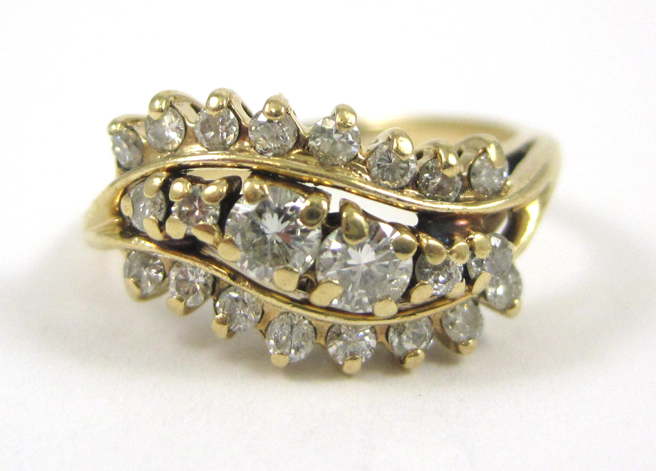 Appraisal: DIAMOND AND FOURTEEN KARAT GOLD RING set with round-cut diamonds