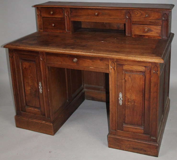 Appraisal: A thC French oak stained and elm desk the upper