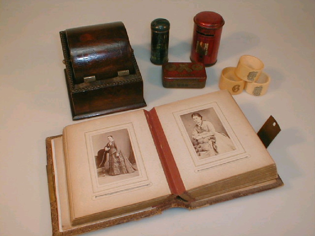 Appraisal: An early thC photograph album with moulded cover and brass