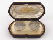 Appraisal: A pair of silver cufflinks unmarked in fitted Hunt Roskell