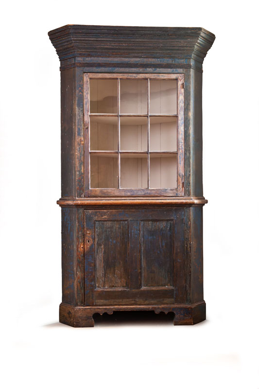 Appraisal: PAINTED CORNER CUPBOARD Pennsylvania late th-early th century pine One-piece