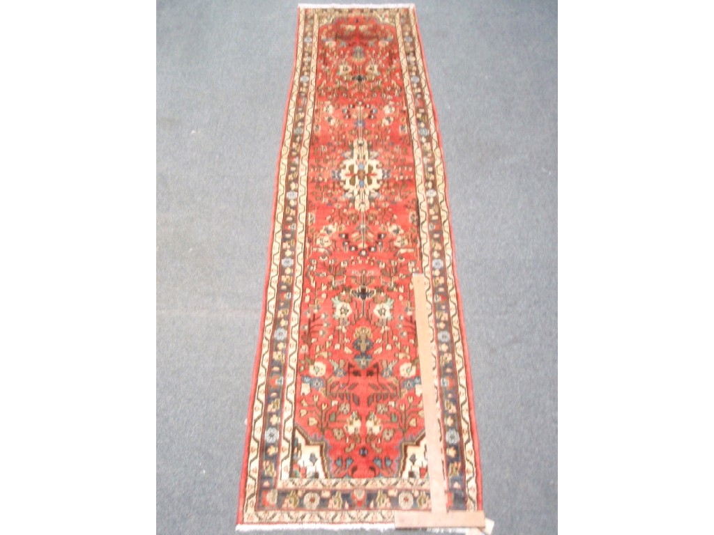 Appraisal: A Persian design floral runner ' x '