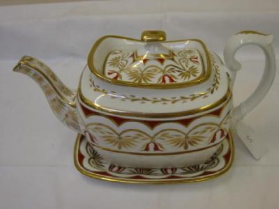 Appraisal: A SPODE PORCELAIN TEAPOT COVER AND STAND of London shape