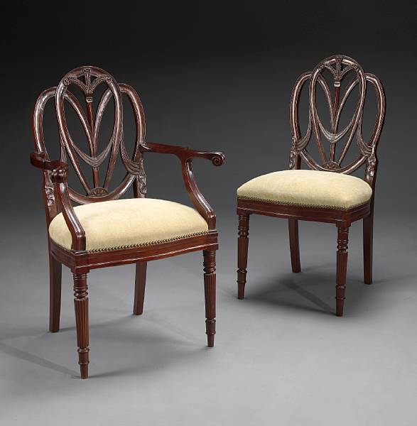 Appraisal: A set of twelve George III style mahogany dining chairs