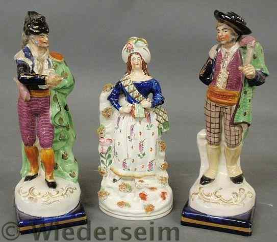 Appraisal: Three Staffordshire figures the pair h As found