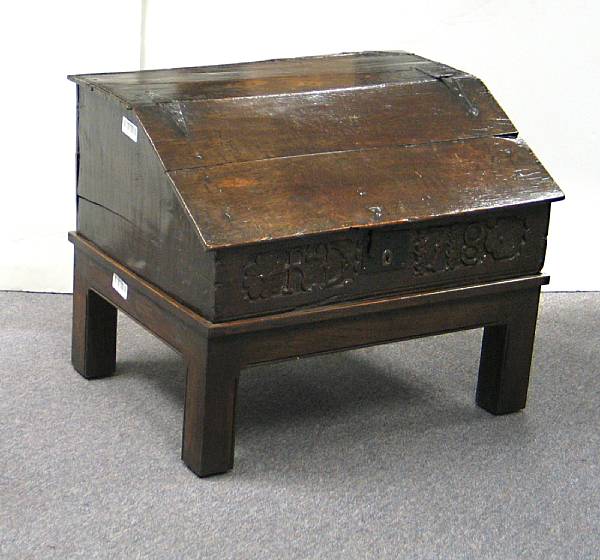 Appraisal: An English carved oak bible box on later stand dated