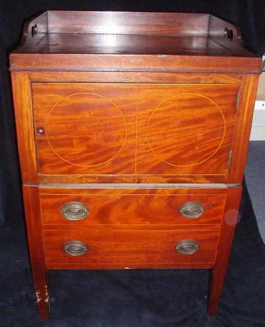 Appraisal: An early th Century mahogany tray top commode the cupboard