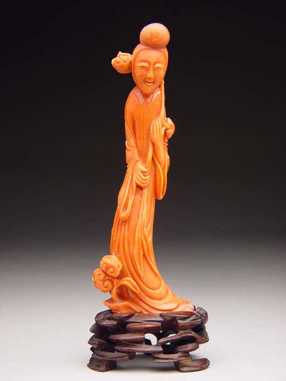 Appraisal: THREE CORAL FIGURES Three Chinese carved coral figures two miniatures