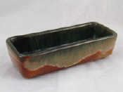 Appraisal: A ceramic rectangular dish the inside mottled green the outside