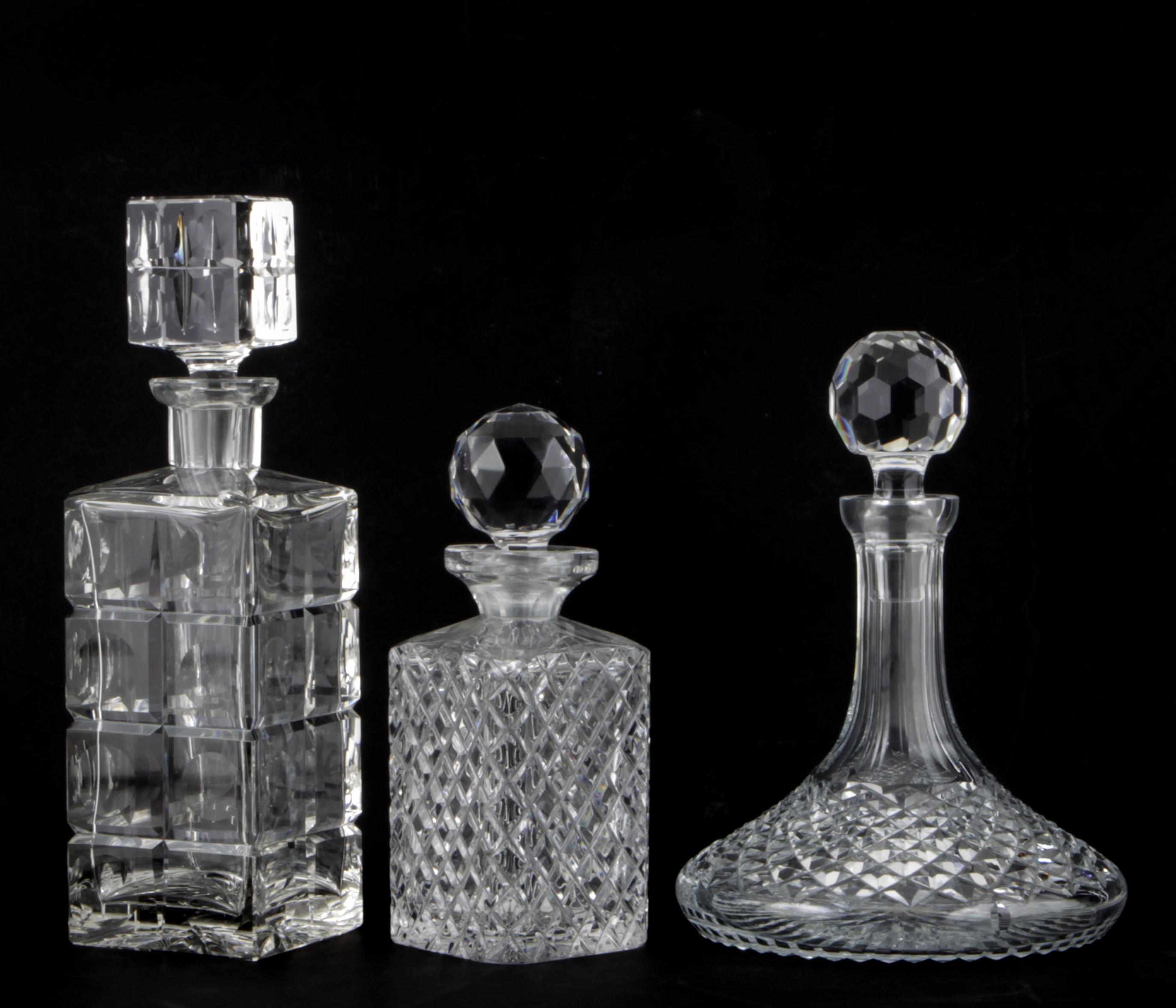 Appraisal: A group of twelve cut glass decanters and stoppers height