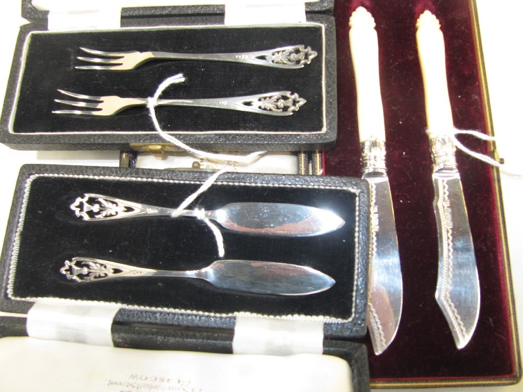 Appraisal: Lot comprising matching pairs of cased silver forks and knives