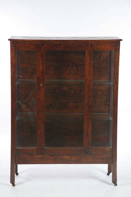 Appraisal: CHINA CABINET Oak with a single glazed door and resting