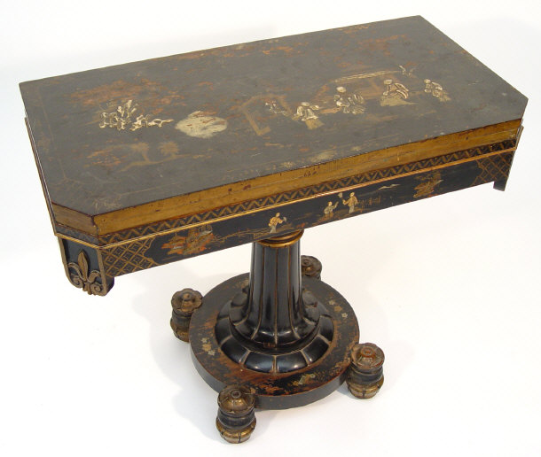 Appraisal: th century black lacquered card table the chinoiserie decorated top