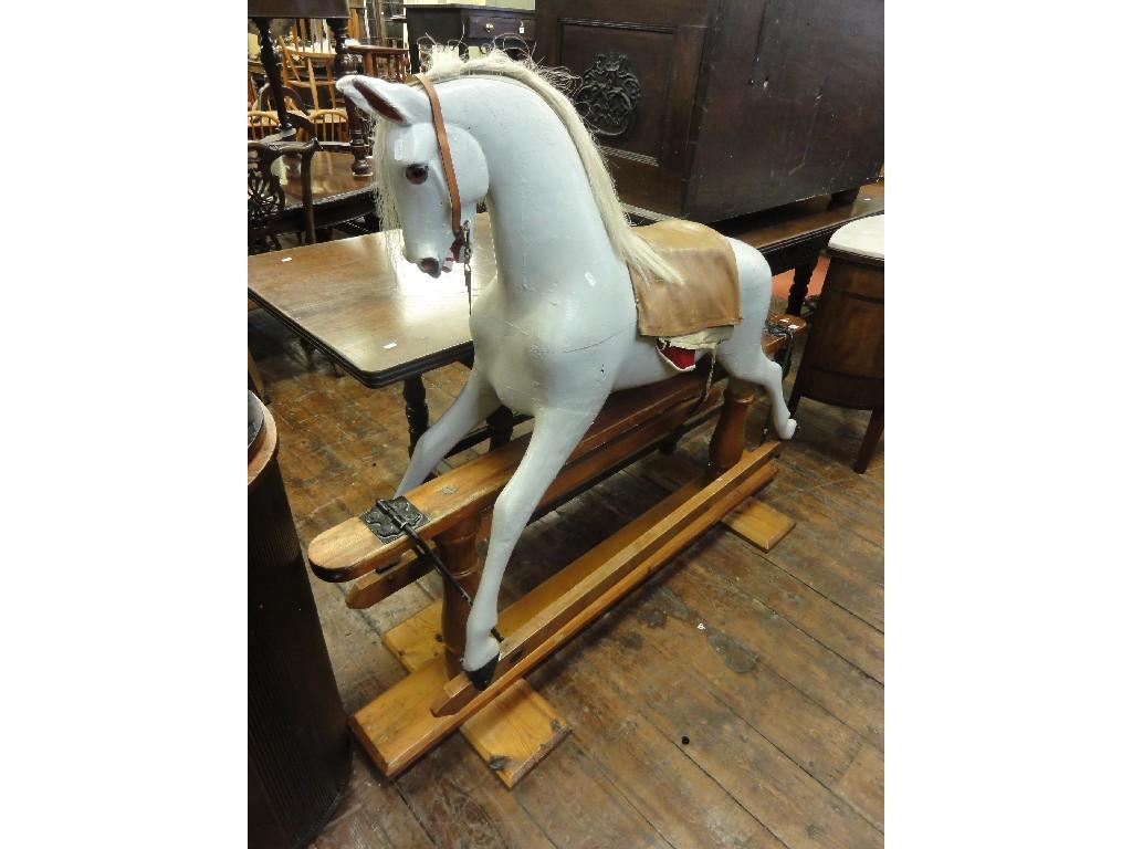 Appraisal: A large rocking horse with timber body raised on a