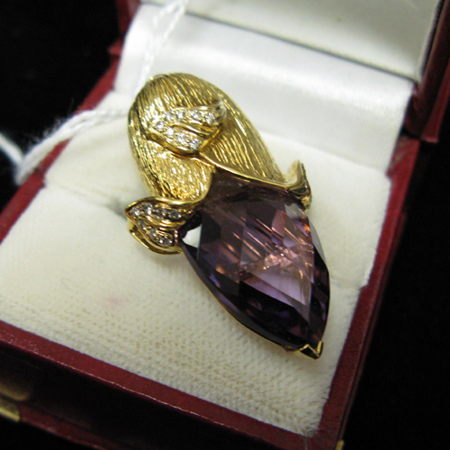 Appraisal: AN AMETHYST DIAMOND AND EIGHTEEN KARAT GOLD FLOWER BUD PENDANT