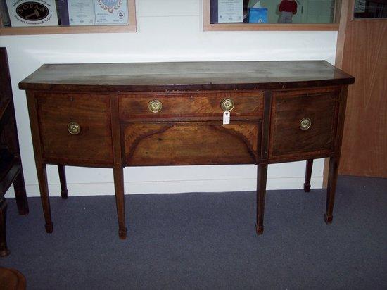 Appraisal: An Edwardian mahogany D shaped sideboard fitted two drawers to