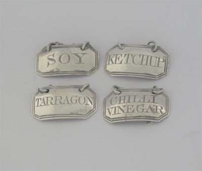 Appraisal: A set of four George III sauce labels of canted