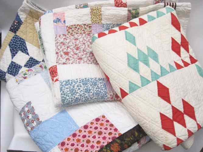 Appraisal: FOUR AMERICAN PATCHWORK QUILTS various patterns hand and machine stitched