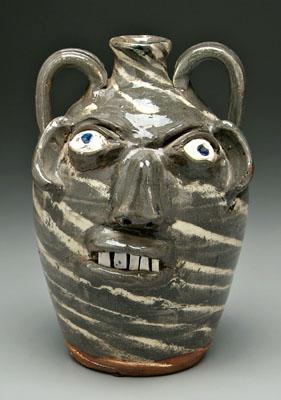 Appraisal: B B Craig swirl stoneware face jug two handles broken