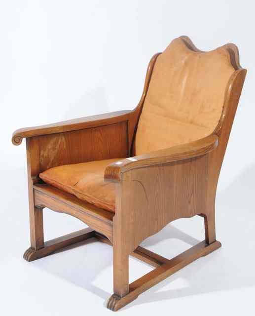 Appraisal: AN ART DECO OAK PANELLED ARMCHAIR with leather loose seat