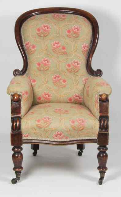 Appraisal: A Victorian upholstered armchair circa with moulded frame to back