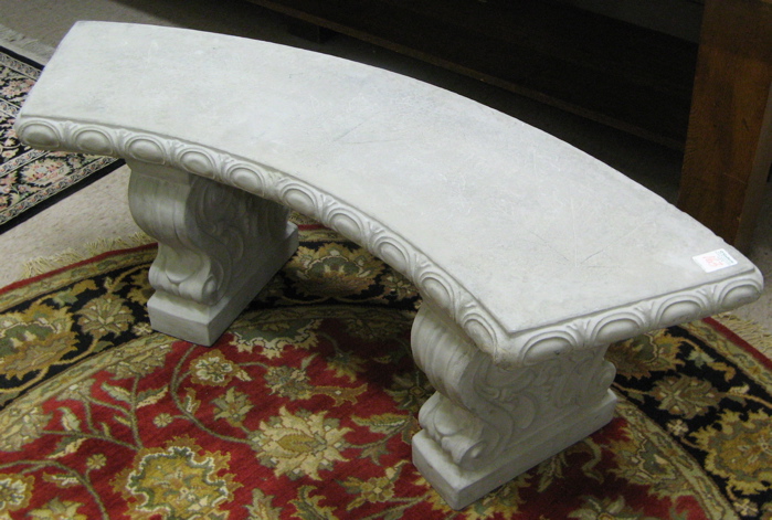 Appraisal: CURVED CAST CONCRETE GARDEN BENCH the curved seated surface decorated