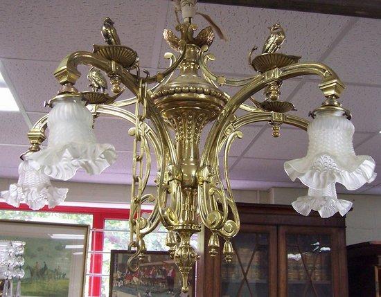 Appraisal: A five-branch brass chandelier circa the scrolling arms set with